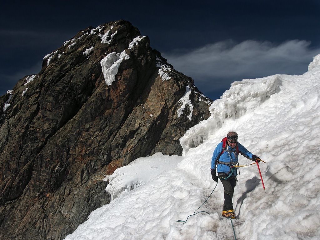 Mountaineer crossing a snow slope in the Rwenzori Mountains